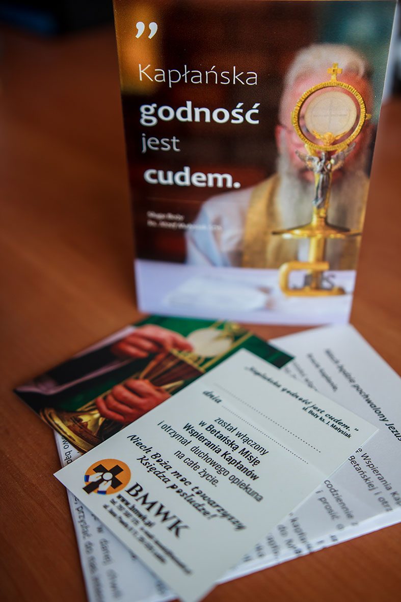 BMWK materials for the priest — a commemorative holy card and a letter